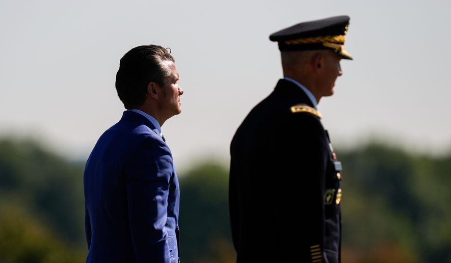 Defense Secretary Pete Hegseth, left, and Army Chief of Staff Gen. Randy George review troops during the POW/MIA National Recognition Day Ceremony at the Pentagon, Sept. 19, 2025, in Washington. (AP Photo/Julia Demaree Nikhinson, File)
