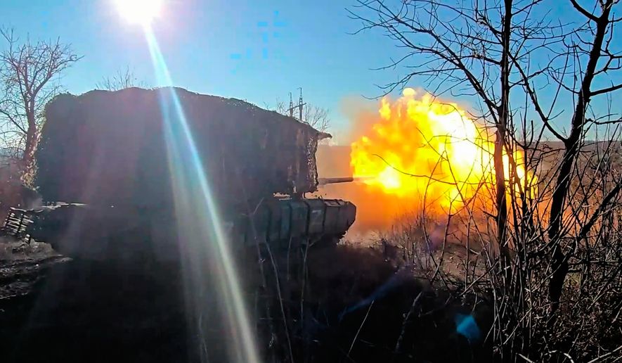 In this image made from video provided by the Russian Defense Ministry Press Service on Saturday, April 4, 2026, a Russian T-72B3M tank fires towards Ukrainian position. (Russian Defense Ministry Press Service via AP)