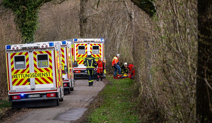 Rescue workers are on the scene after an accident in a wooded area south-east of Flensburg, Germany on Sunday, April 5, 2026. (Benjamin Nolte/dpa via AP)