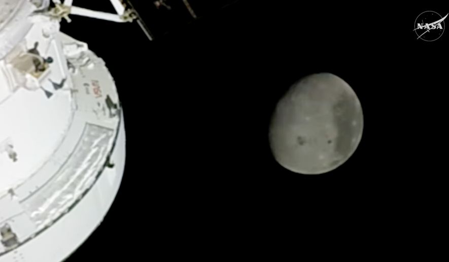In this image from video provided by NASA, the Moon is seen from a camera outside the Orion Spacecraft after the Artemis II astronauts surpassed the farthest distance ever traveled by humans from Earth, Monday, April 6, 2026. (NASA via AP)