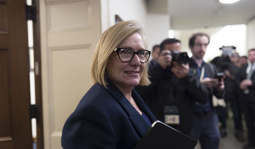 Rep. Michelle Fischbach, R-Minn., a member of the House Ethics Committee, rushes past reporters without speaking after the panel met to consider the investigation of former Rep. Matt Gaetz, R-Fla., President-elect Donald Trump's choice to be attorney general, at the Capitol in Washington, Wednesday, Nov. 20, 2024. (AP Photo/J. Scott Applewhite)