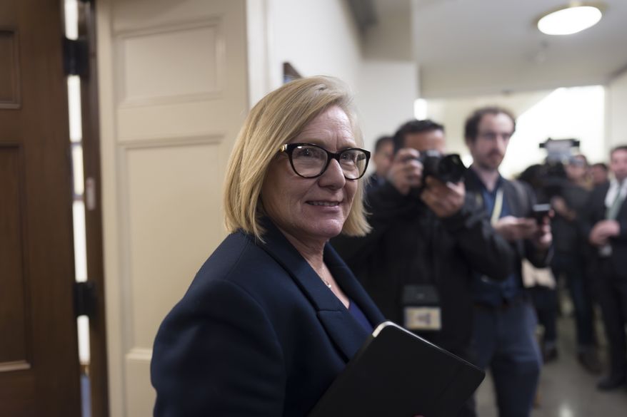 Rep. Michelle Fischbach, R-Minn., a member of the House Ethics Committee, rushes past reporters without speaking after the panel met to consider the investigation of former Rep. Matt Gaetz, R-Fla., President-elect Donald Trump's choice to be attorney general, at the Capitol in Washington, Wednesday, Nov. 20, 2024. (AP Photo/J. Scott Applewhite)