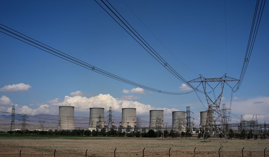 The Damavand power station is seen from a nearby road on the outskirts of Tehran, Iran, Tuesday, April 7, 2026. (AP Photo/Francisco Seco)