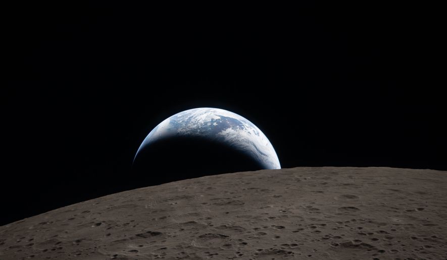 In this image provided by NASA, The Artemis II crew captured this view of an Earthset on Monday, April 6, 2026, as they flew around the Moon. (NASA via AP)