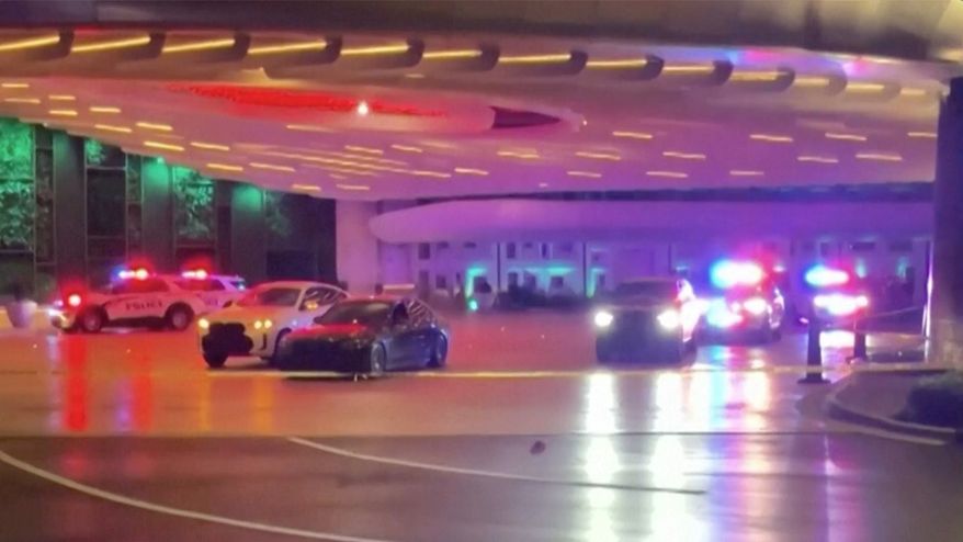 Police and emergency personnel respond to the scene of a shooting at a valet area outside of the Seminole Hard Rock in Hollywood, Fla., on Monday, April 6, 2026. (WSVN via AP)