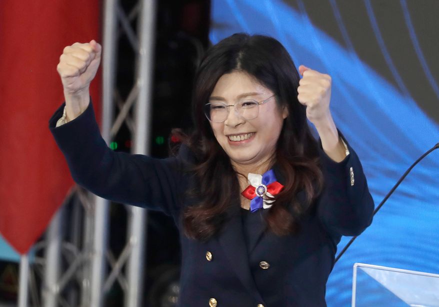 Cheng Li-wun, newly elected chairperson of Taiwan's main opposition Nationalist Party, or Kuomintang (KMT), cheers during a party congress in Taipei, Taiwan, on Nov. 1, 2025. (AP Photo/Chiang Ying-ying, File)