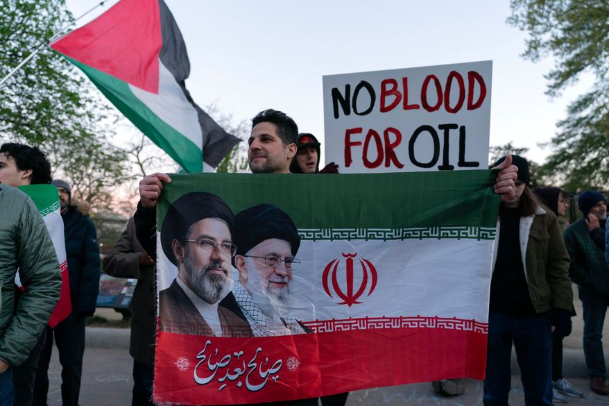 Activists protest near the White House in Washington, Tuesday evening, April 7, 2026.(AP Photo/Jose Luis Magana)