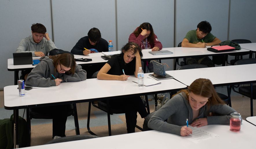 FILE - Students take a test during a class at Nueta Hidatsa Sahnish College, Thursday, Oct. 30, 2025, in New Town, N.D. (AP Photo/John Locher, File)