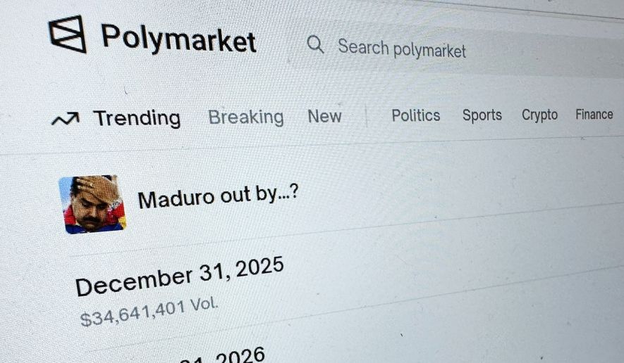 FILE - The Polymarket prediction market website is displayed on a computer screen, Jan. 11, 2026, in New York. (AP Photo/Wyatte Grantham-Philips, File)