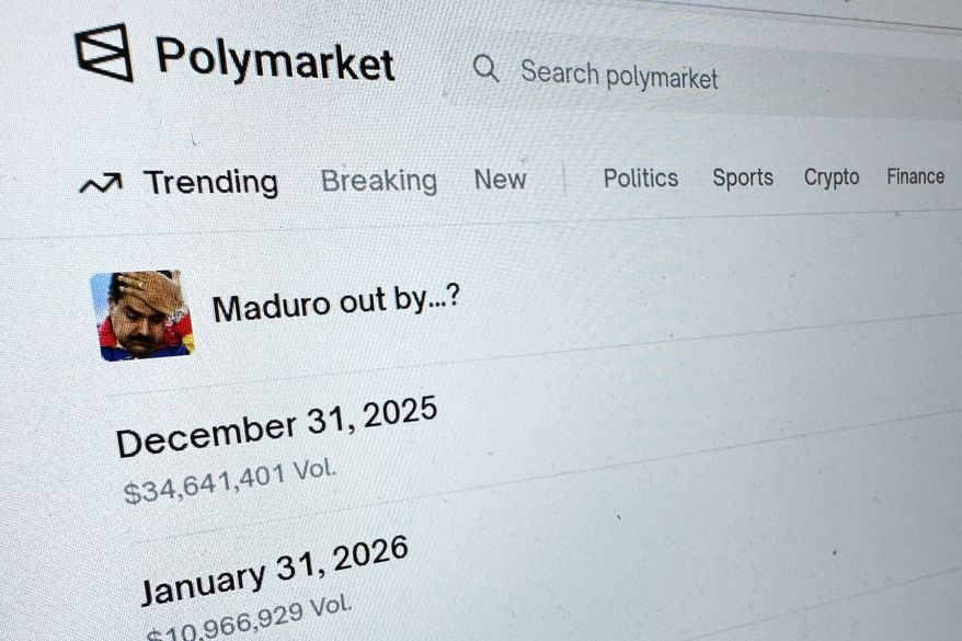 FILE - The Polymarket prediction market website is displayed on a computer screen, Jan. 11, 2026, in New York. (AP Photo/Wyatte Grantham-Philips, File)