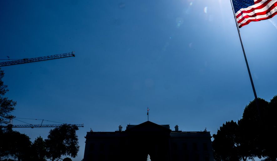 Cranes being used to construct the new White House ballroom are seen around the White House, Saturday, April 4, 2026, in Washington. (AP Photo/Julia Demaree Nikhinson)