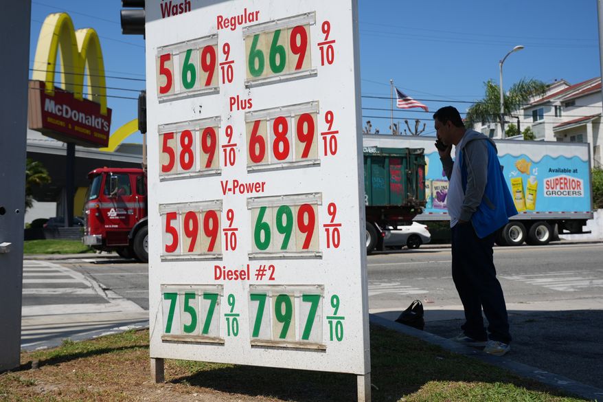 Gas prices are displayed at a gasoline station, Tuesday, April 7, 2026, in Los Angeles. (AP Photo/Damian Dovarganes, File)