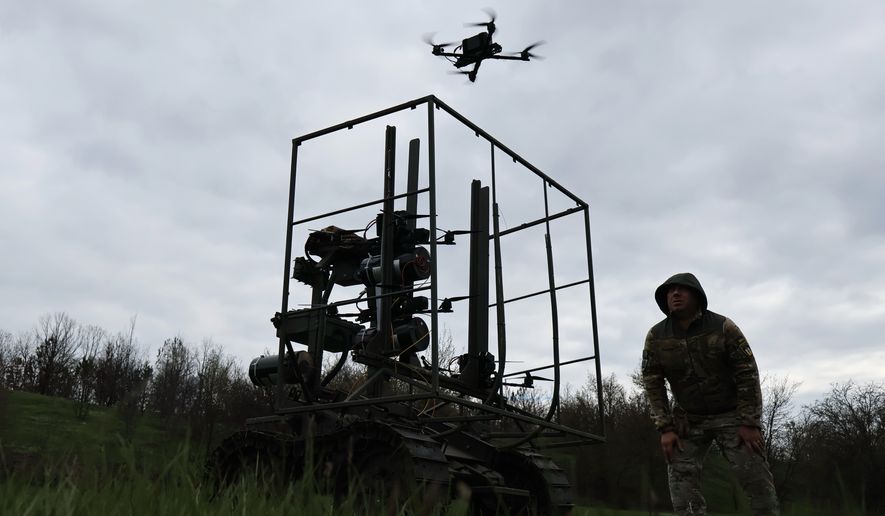 In this photo provided by Ukraine's 65th Mechanised Brigade press service on April 10, 2026, a Ukrainian serviceman looks at FPV drone takeoff during a training at the polygon in Zaporizhzhia region, Ukraine. (Andriy Andriyenko/Ukraine's 65th Mechanised Brigade via AP)