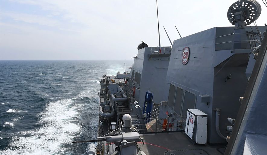 FILE - In this photo provided by the U.S. Navy, the Arleigh Burke-class guided-missile destroyer USS Halsey (DDG 97) conducts routine underway operations while transiting through the Taiwan Strait, May 8, 2024. (Mass Communication Specialist 3rd class Ismael Martinez/U.S. Navy via AP, File)