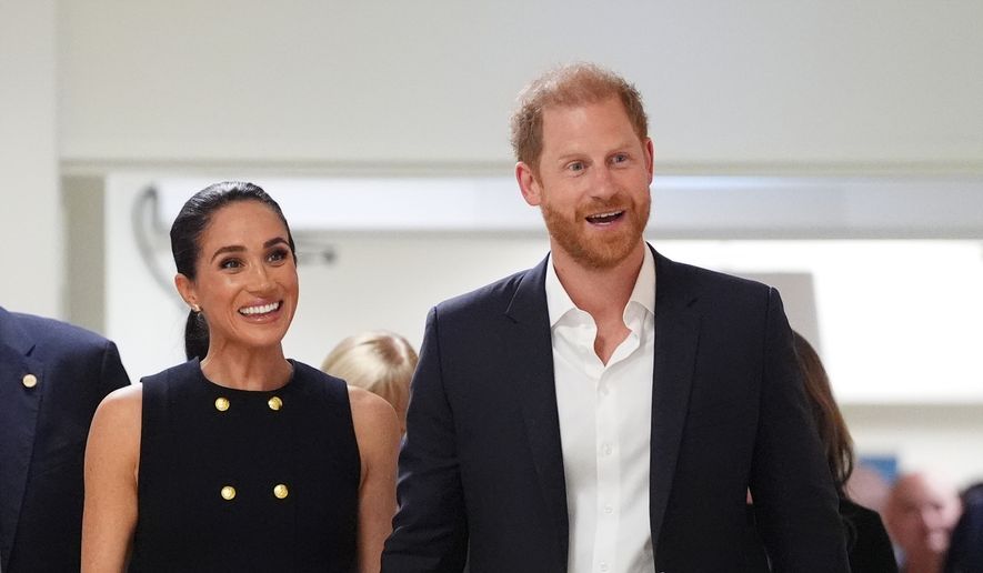 Britain's Prince Harry and Meghan Markle, the Duke and Duchess of Sussex, visit the Royal Children's Hospital Melbourne, Australia Tuesday, April 14, 2026. (Jonathan Brady/Pool Photo via AP)