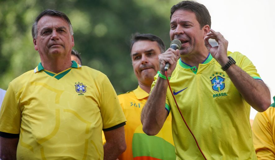 FILE - Mayoral pre-candidate for Rio de Janeiro, Alexandre Ramagem, campaigns as former Brazilian President Jair Bolsonaro stands by in Rio de Janeiro, July 18, 2024. (AP Photo/Bruna Prado, File)