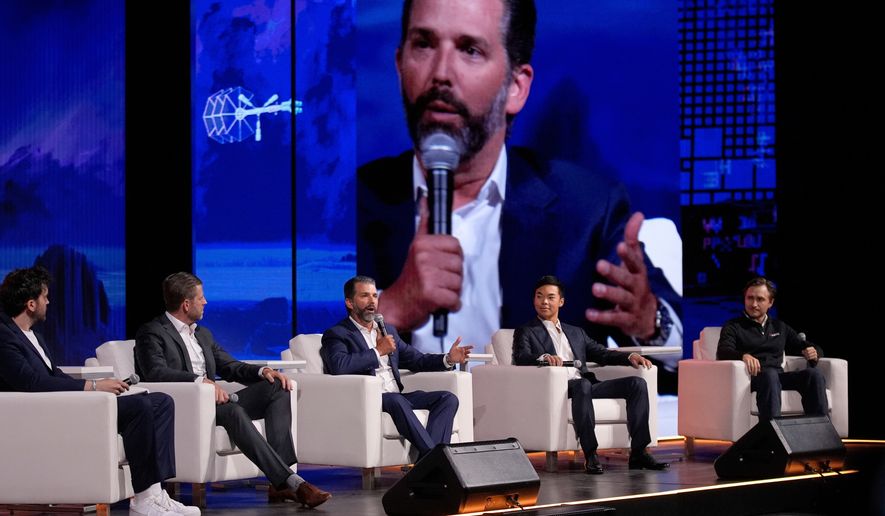 From left, moderator Aaron Arnold, Eric Trump, Donald Trump Jr., Mike Ho, executive chairman of American Bitcoin and Matt Prusak, CEO of American Bitcoin, sit on stage at Bitcoin 2025 in Las Vegas on Wednesday, May 28, 2025. (AP Photo/John Locher) **FILE**