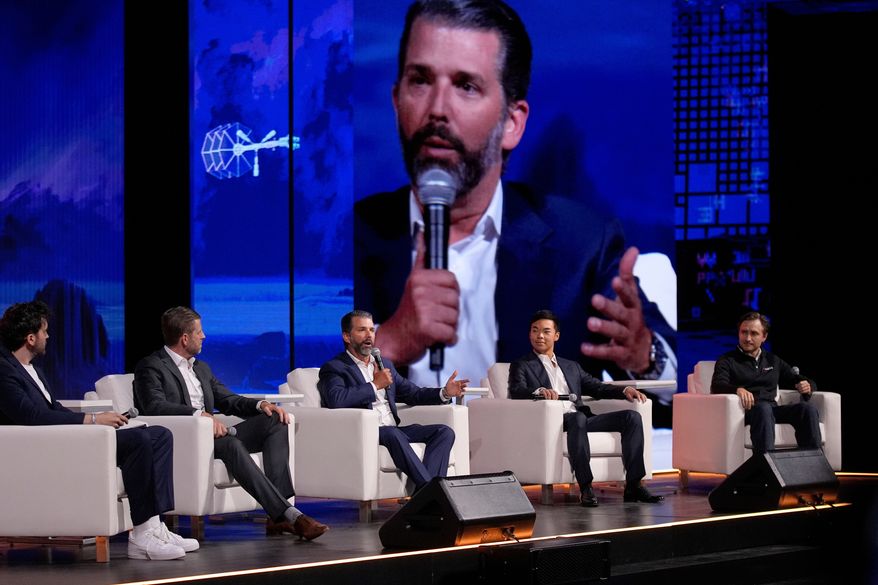 From left, moderator Aaron Arnold, Eric Trump, Donald Trump Jr., Mike Ho, executive chairman of American Bitcoin and Matt Prusak, CEO of American Bitcoin, sit on stage at Bitcoin 2025 in Las Vegas on Wednesday, May 28, 2025. (AP Photo/John Locher) **FILE**