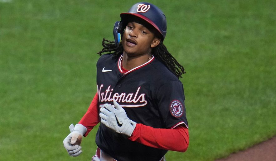 Washington Nationals' C.J. Abrams crosses home plate after hitting a solo home run off Pittsburgh Pirates pitcher Mitch Keller during the third inning of a baseball game in Pittsburgh, Tuesday, April 14, 2026. (AP Photo/Gene J. Puskar)
