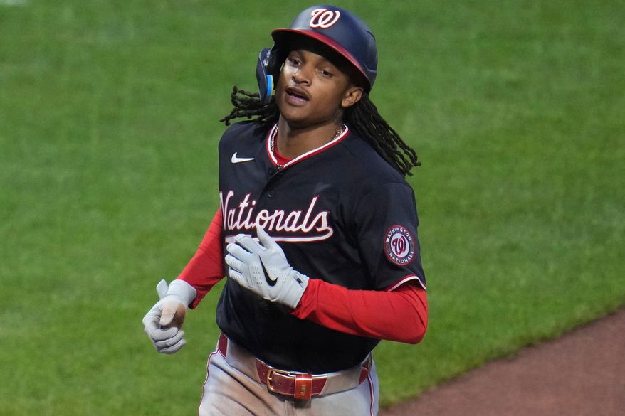 Washington Nationals' C.J. Abrams crosses home plate after hitting a solo home run off Pittsburgh Pirates pitcher Mitch Keller during the third inning of a baseball game in Pittsburgh, Tuesday, April 14, 2026. (AP Photo/Gene J. Puskar)