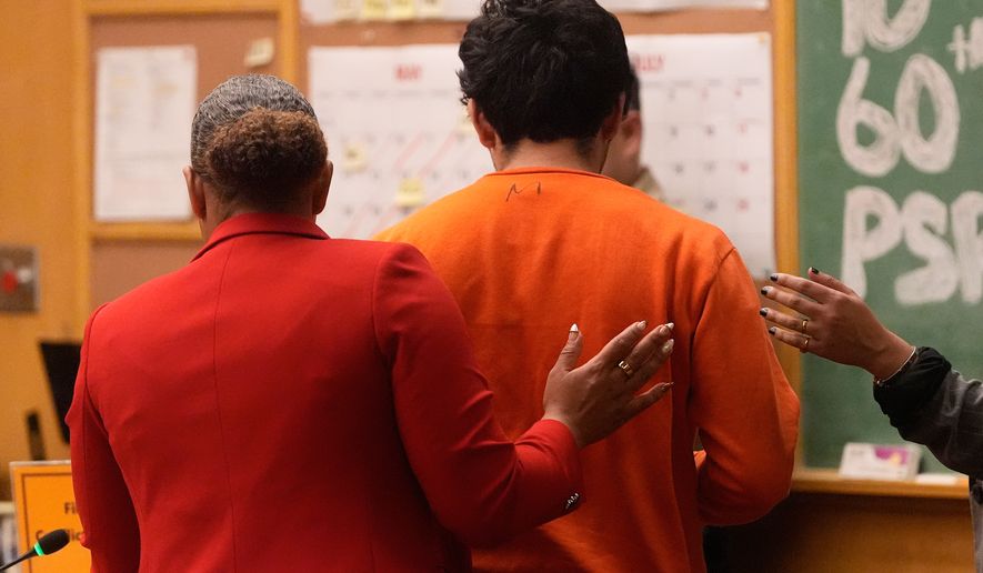Daniel Moreno-Gama, right, leaves court with public defender Diamond Ward on Tuesday, April 14, 2026, in San Francisco. (AP Photo/Jeff Chiu, Pool)