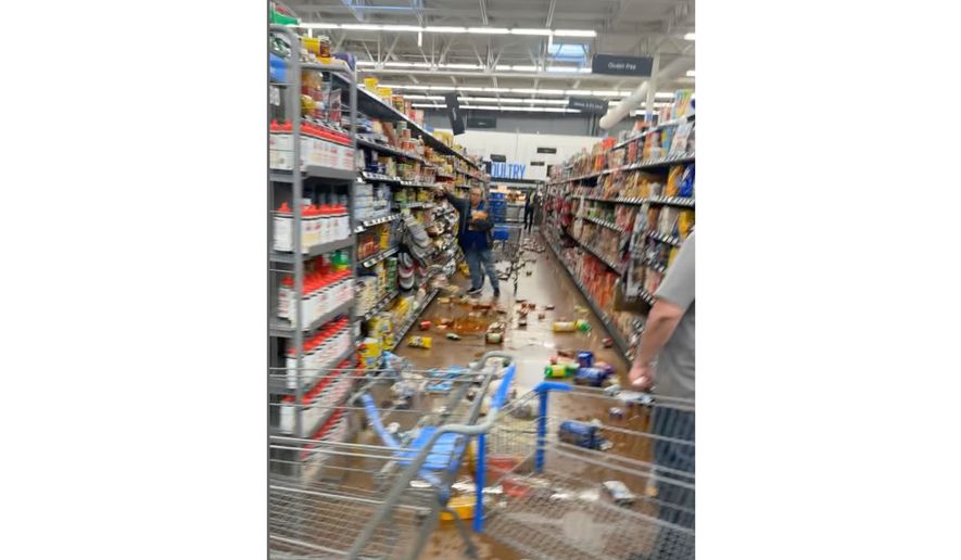 Items are scattered across grocery store aisle floors in Fallon, Nevada. on Monday, April 13, 2026 after a magnitude-5.7 earthquake. (Kaitlin Ritchie via AP)