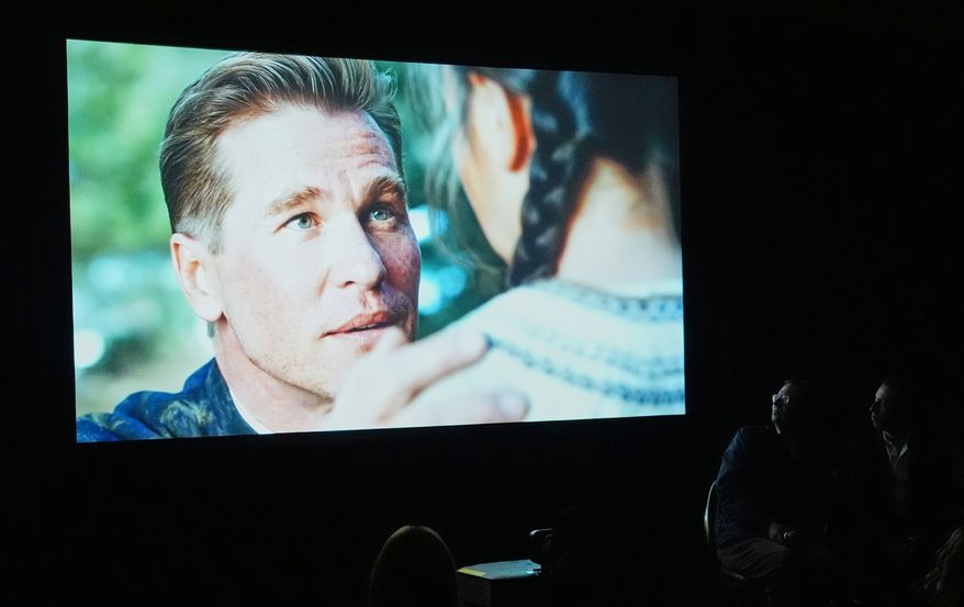 People watch a trailer for the upcoming film “As Deep as the Grave” featuring a character played by a generative AI version of Val Kilmer at CinemaCon on Wednesday, April 15, 2026, at Caesars Palace in Las Vegas. (AP Photo/Chris Pizzello)
