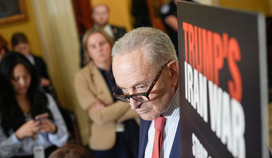 Senate Minority Leader Chuck Schumer, D-N.Y., listens during a news conference after a policy luncheon on Capitol Hill,Tuesday, April 14, 2026, in Washington. (AP Photo/Mariam Zuhaib)