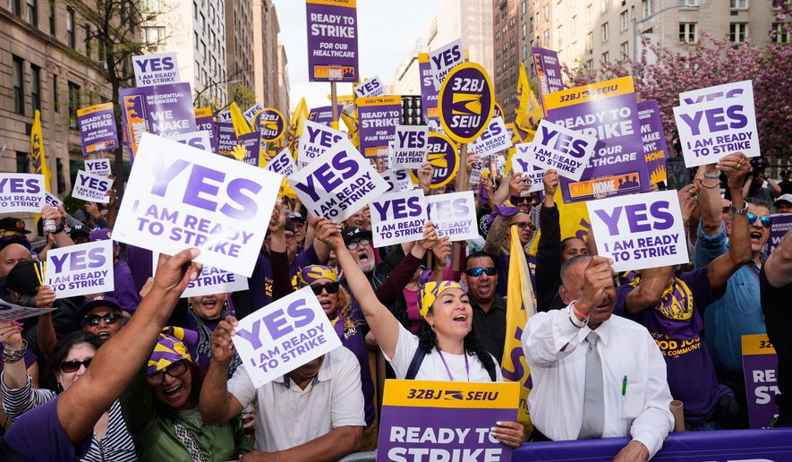 Members of the 32BJ SEIU union vote to authorize a strike during a rally on Park Avenue, in New York, Wednesday, April 15, 2026. (AP Photo/Seth Wenig)
