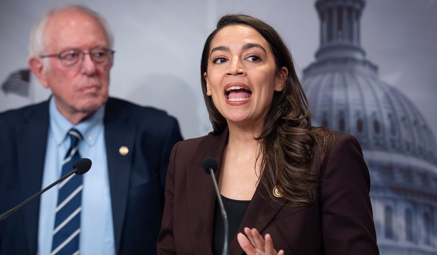 Sen. Bernie Sanders, I-Vt., left, and Rep. Alexandria Ocasio Cortez, D-N.Y., hold a news conference on the Artificial Intelligence Data Center Moratorium Act, at the Capitol in Washington, Wednesday, March 25, 2026. (AP Photo/J. Scott Applewhite)