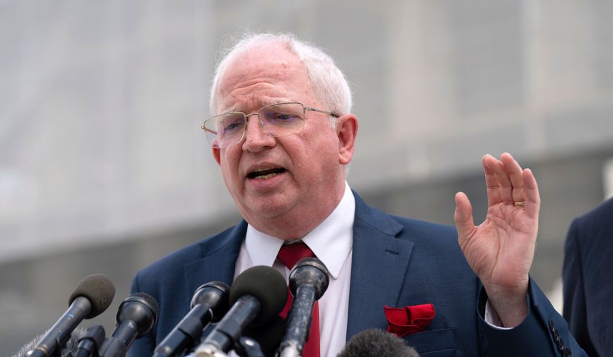 John Eastman, a California law professor, speaks to reporters after a Supreme Court hearing on birthright citizenship outside of the Supreme Court in Washington, May 15, 2025. (AP Photo/Jose Luis Magana, File)