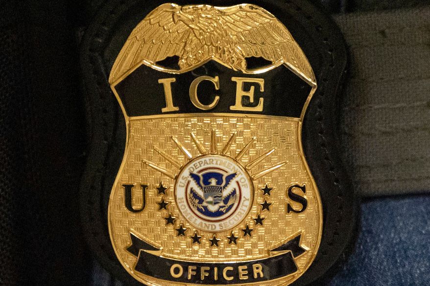 A federal agent wears an Immigration and Customs Enforcement badge, June 10, 2025, in New York. (AP Photo/Yuki Iwamura, File)