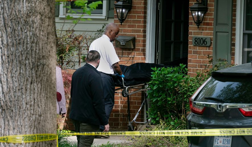 Fairfax County coroners remove a body from the home of former Virginia Lt. Gov. Justin Fairfax, in Annandale, Va., Thursday, April 16, 2026. (AP Photo/Cliff Owen)