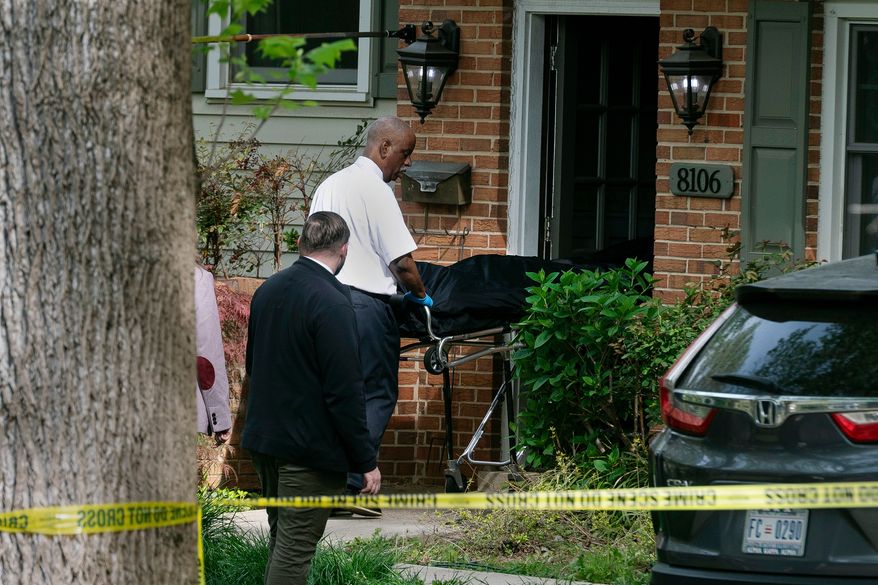 Fairfax County coroners remove a body from the home of former Virginia Lt. Gov. Justin Fairfax, in Annandale, Va., Thursday, April 16, 2026. (AP Photo/Cliff Owen)