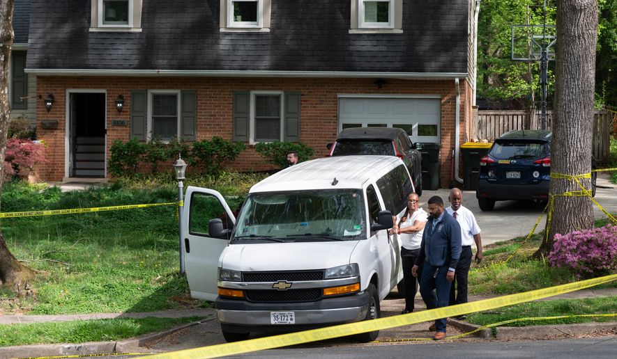 Fairfax County coroners, with two bodies in the van, prepare to leave the home of former Virginia Lt. Gov. Justin Fairfax, in Annandale, Va., Thursday, April 16, 2026. (AP Photo/Cliff Owen)