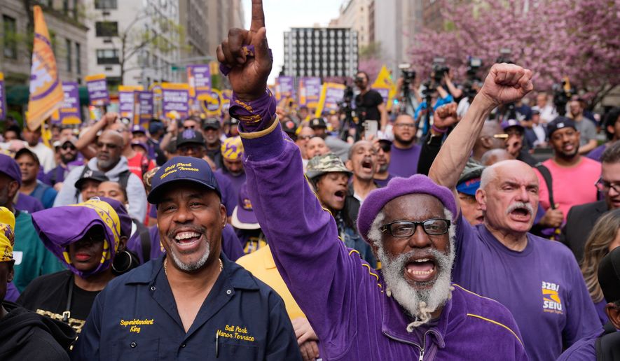 Members of the 32BJ SEIU union and their supporters rally on Park Avenue, in New York, Wednesday, April 15, 2026. (AP Photo/Seth Wenig)