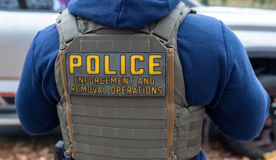 Federal law enforcement officers with Immigration and Customs Enforcement (ICE) and Enforcement and Removal Operations (ERO) conduct a traffic stop and detain people, Nov. 17, 2025, in Washington. (AP Photo/Alex Brandon, File)