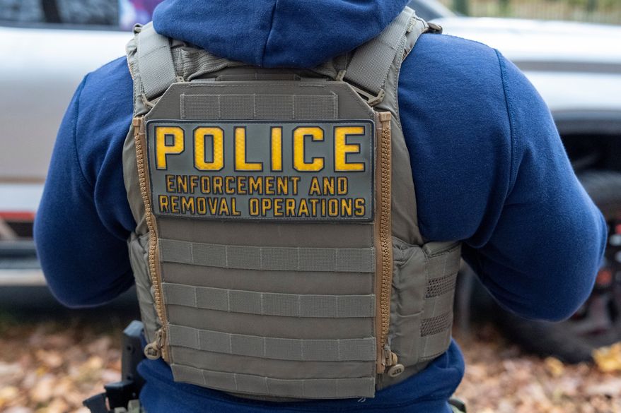 Federal law enforcement officers with Immigration and Customs Enforcement (ICE) and Enforcement and Removal Operations (ERO) conduct a traffic stop and detain people, Nov. 17, 2025, in Washington. (AP Photo/Alex Brandon, File)