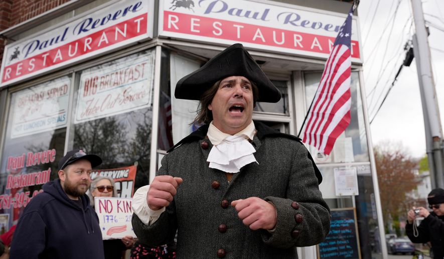Brig. Gen. Richard Reale, dressed as American patriot Paul Revere, speaks to a crowd outside the Paul Revere Restaurant while reenacting the 1775 Boston-to-Lexington ride to alert colonists of approaching British troops, Monday, April 20, 2026, in Medford, Mass. (AP Photo/Robert F. Bukaty) ** FILE **