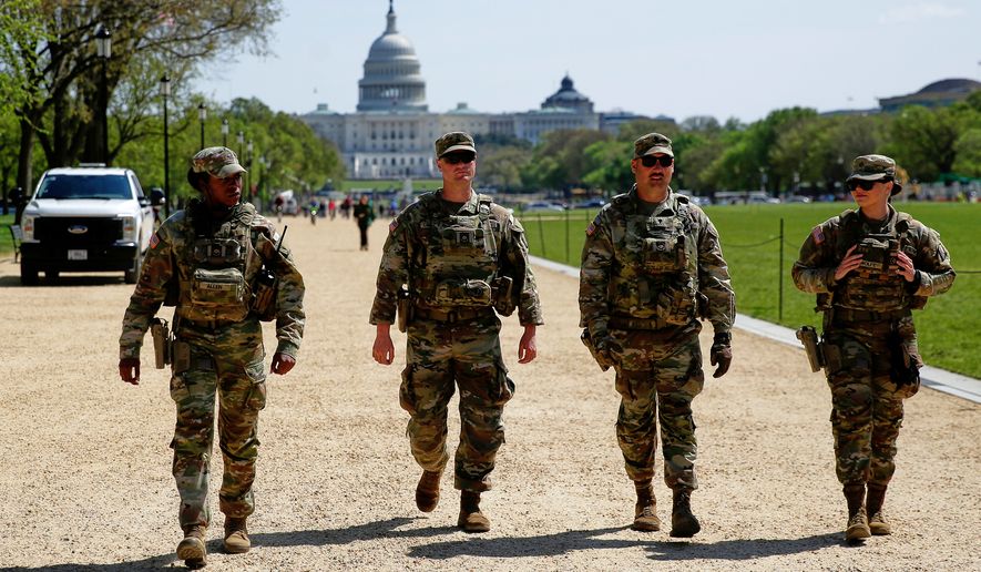 The National Guard patrols the Washington Mall in Washington, with the U.S. Capitol in the background, on April 7, 2026. (AP Photo/Rahmat Gul) **FILE**