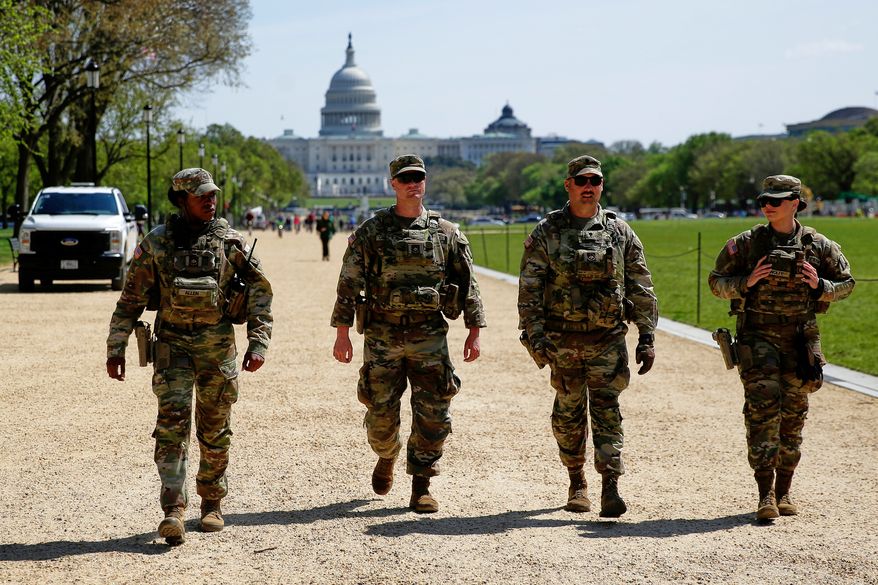 The National Guard patrols the Washington Mall in Washington, with the U.S. Capitol in the background, on April 7, 2026. (AP Photo/Rahmat Gul) **FILE**