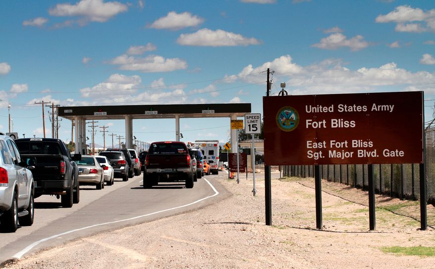 Cars wait to enter Fort Bliss, Texas, on Sept. 9, 2014. (AP Photo/Juan Carlos Llorca) **FILE**