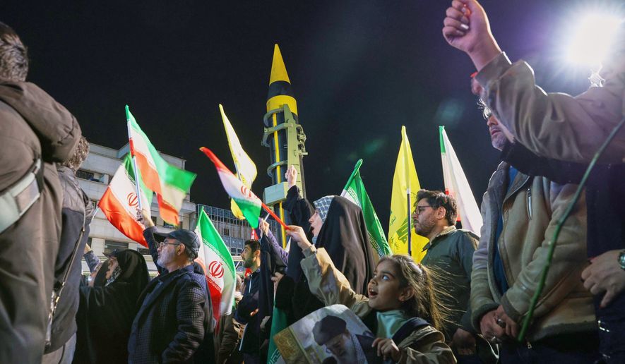 A ballistic missile is displayed by Iran's Revolutionary Guard during a pro-government demonstration at Enqelab-e-Eslami (Islamic Revolution) Square in downtown Tehran, Iran, Tuesday, April 21, 2026. (Alireza Masoumi/ISNA via AP)