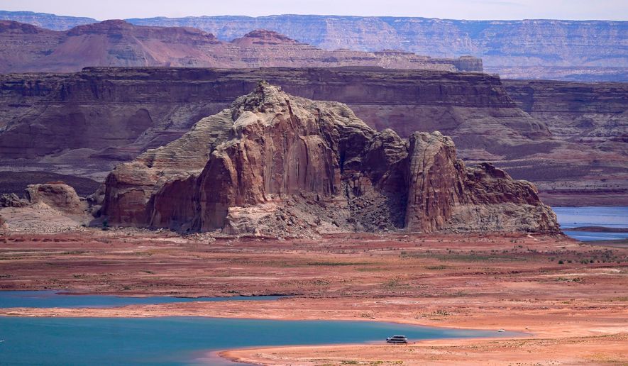 FILE - Low water levels at Wahweap Bay at Lake Powell, along the Upper Colorado River Basin are shown, June 9, 2021, at the Utah and Arizona border at Wahweap, Ariz. (AP Photo/Ross D. Franklin, File)