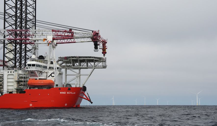 A vessel is visible near Sunrise Wind offshore wind farm that is under construction off the coast of Montauk Point, New York, Thursday, April 23, 2026. (AP Photo/Joshua A. Bickel)