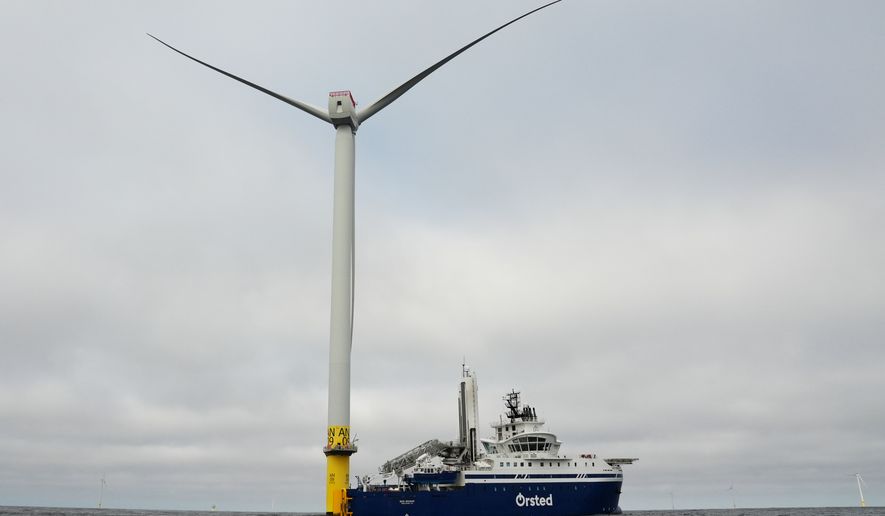 People work on a turbine near an Orsted boat at South Fork Wind offshore wind farm off the coast of Block Island, R.I., Thursday, April 23, 2026. (AP Photo/Joshua A. Bickel) **FILE**