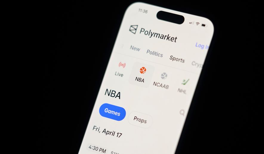 A phone displays sports trades on Polymarket on Thursday, April 16, 2026, in Portland, Ore. (AP Photo/Jenny Kane)