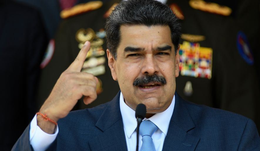 FILE - Venezuelan President Nicolas Maduro gives a press conference at the Miraflores presidential palace, March 12, 2020, in Caracas, Venezuela. (AP Photo/Matias Delacroix, File)
