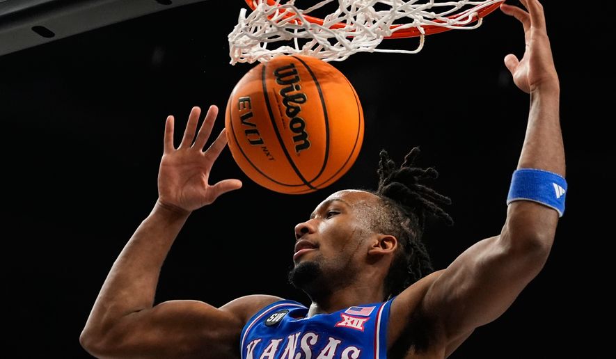 Kansas' Darryn Peterson dunks during the first half of an NCAA college basketball game against Houston in the semifinal round of the Big 12 Conference tournament March 13, 2026, in Kansas City, Mo. (AP Photo/Charlie Riedel, File)