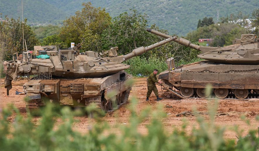An Israeli soldier works on tanks in northern Israel, on the border with Lebanon following a ceasefire between Israel and Hezbollah, Friday, April 17, 2026. (AP Photo/Ariel Schalit)